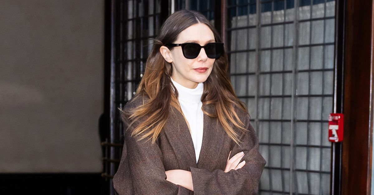 Elizabeth Olsen Hit the Airport in Winter's Richest Denim Trend and "It" Coat Color