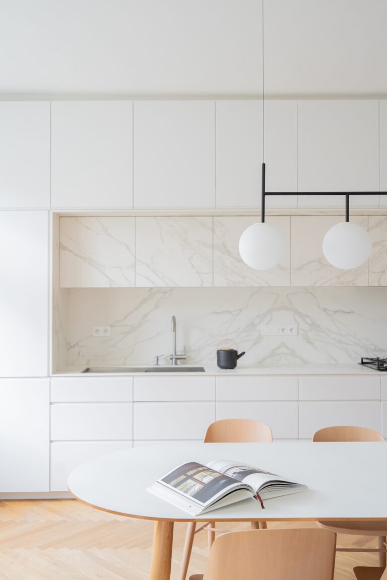 white cabinetry and backsplash in kitchen