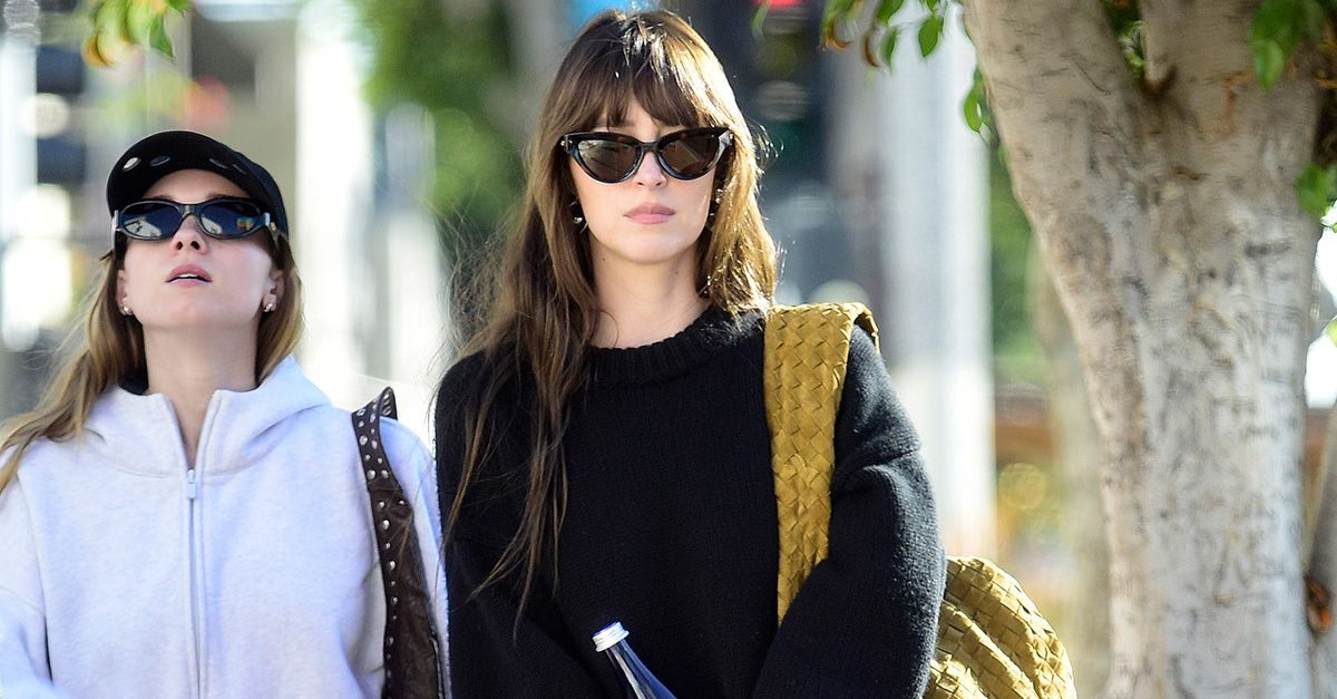 Dakota Johnson Just Wore the Skirt Trend Fashion People Use To Make Sweaters Look Much Chicer